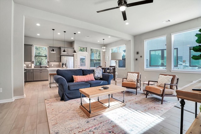 477 Long Leaf Pine Dr, Montgomery, TX 77316 - living area featuring light wood-style floors, ceiling fan, baseboards, and recessed lighting