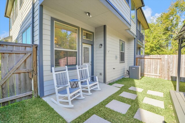 477 Long Leaf Pine Dr, Montgomery, TX 77316 - view of patio featuring central AC unit and a gate