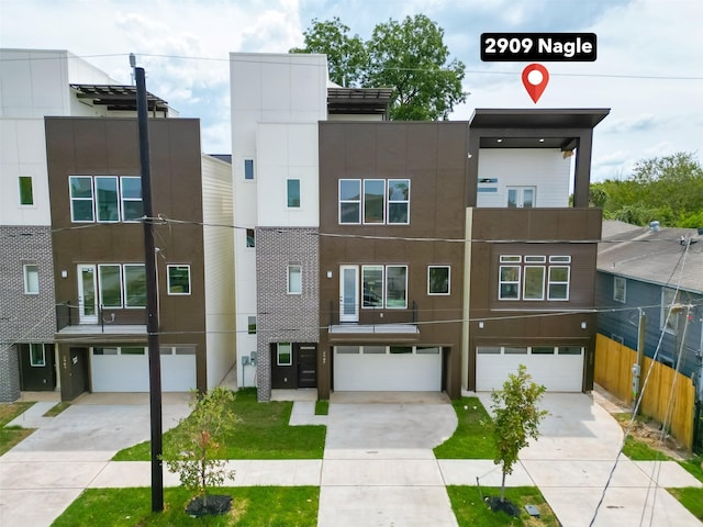 2909 Nagle St, Houston, TX 77004 - view of building exterior with an attached garage and driveway