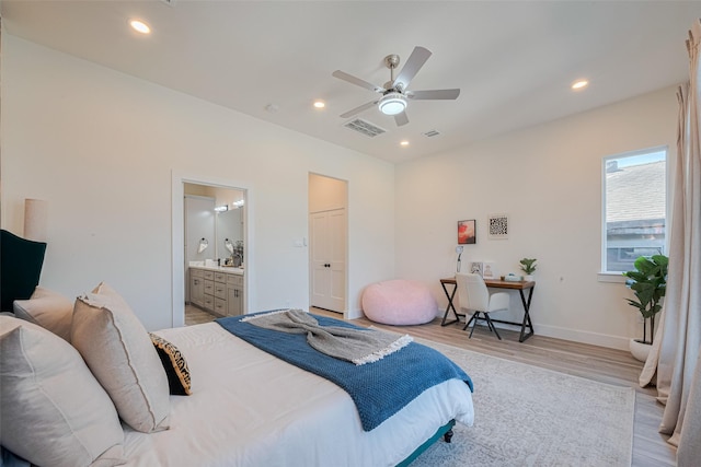 2909 Nagle St, Houston, TX 77004 - bedroom with light wood-type flooring, recessed lighting, ensuite bathroom, baseboards, and ceiling fan