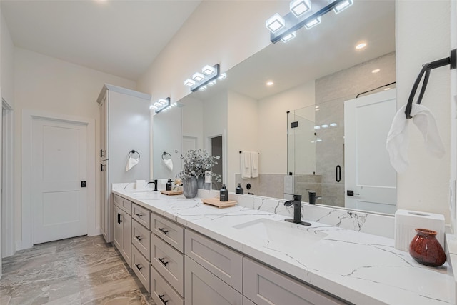 2909 Nagle St, Houston, TX 77004 - full bathroom with a shower stall, marble finish flooring, double vanity, and recessed lighting