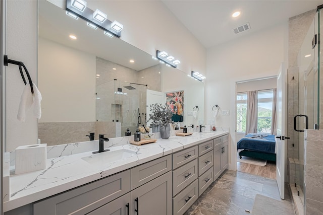 2909 Nagle St, Houston, TX 77004 - full bath featuring a shower stall, double vanity, marble finish floors, recessed lighting, and ensuite bath