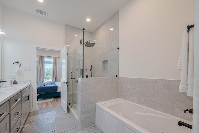 2909 Nagle St, Houston, TX 77004 - bathroom featuring a whirlpool tub, a shower stall, vanity, ensuite bathroom, and recessed lighting