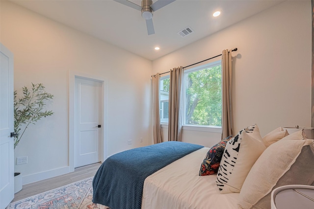 2909 Nagle St, Houston, TX 77004 - bedroom featuring light wood-type flooring, baseboards, a ceiling fan, and recessed lighting