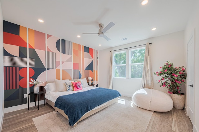 2909 Nagle St, Houston, TX 77004 - bedroom featuring an accent wall, wood finished floors, recessed lighting, baseboards, and wallpapered walls