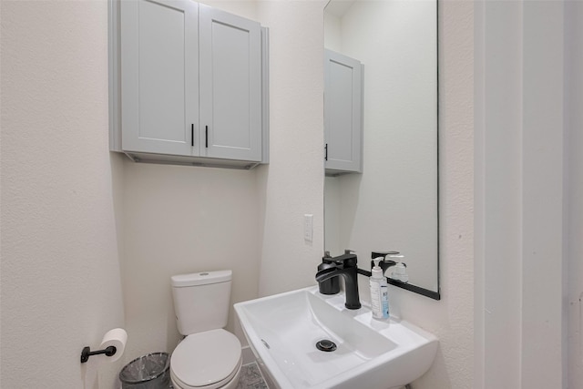 2909 Nagle St, Houston, TX 77004 - half bathroom featuring a sink and toilet
