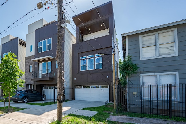 2909 Nagle St, Houston, TX 77004 - view of front facade with concrete driveway, an attached garage, and fence