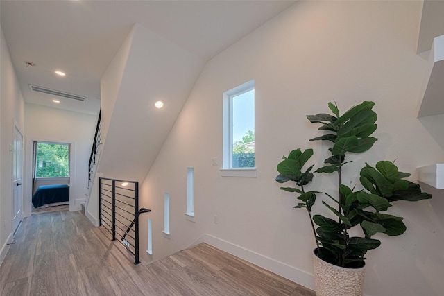 2909 Nagle St, Houston, TX 77004 - stairs featuring wood finished floors, baseboards, and recessed lighting