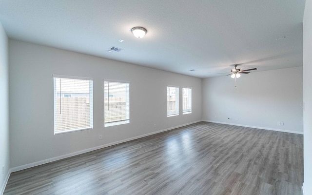 4350 Maple Root Ln, Pinehurst, TX 77362 - unfurnished room featuring wood finished floors and ceiling fan