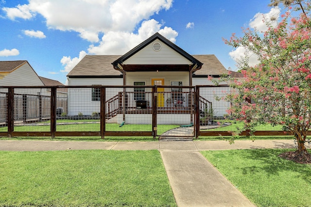 5120 Leeland St, Houston, TX 77023 - view of front of property with a gate, a shingled roof, and a porch