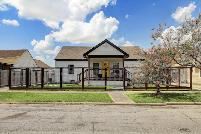5120 Leeland St, Houston, TX 77023 - view of front of house with a fenced front yard and a gate