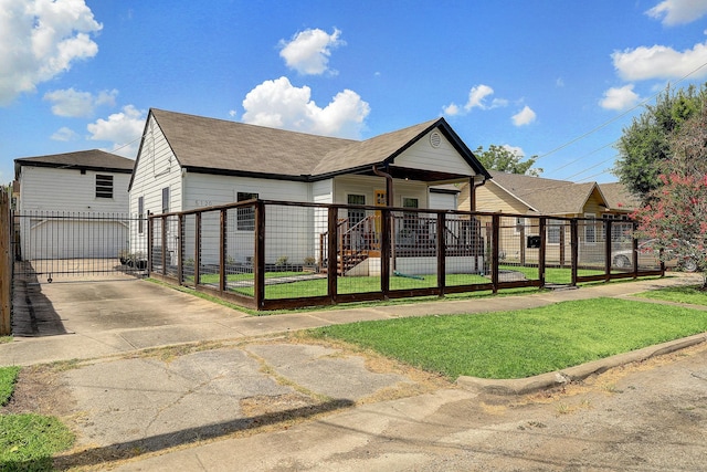 5120 Leeland St, Houston, TX 77023 - view of front of home featuring a gate, a porch, and roof with shingles