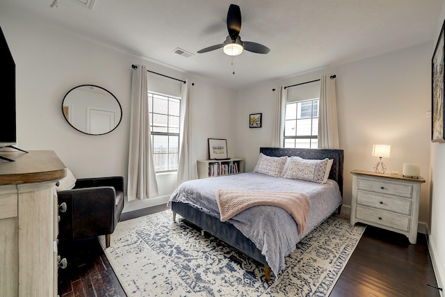 5120 Leeland St, Houston, TX 77023 - bedroom with wood finished floors, baseboards, and ceiling fan