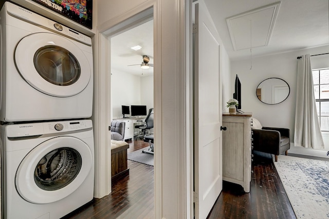 5120 Leeland St, Houston, TX 77023 - washroom featuring attic access, stacked washer and clothes dryer, dark wood-style flooring, and a desk