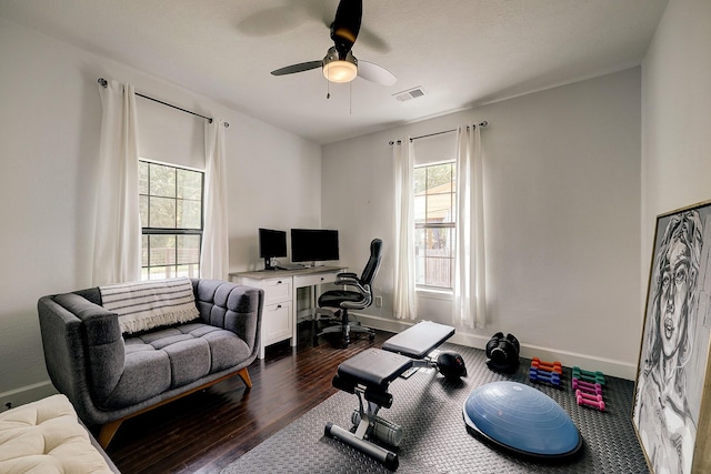 5120 Leeland St, Houston, TX 77023 - office area featuring dark wood-style flooring, a ceiling fan, and baseboards