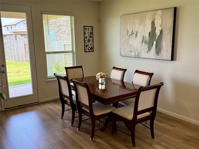 2900 Glint Peak Ct, Katy, TX 77493 - dining room featuring plenty of natural light, wood finished floors, and baseboards