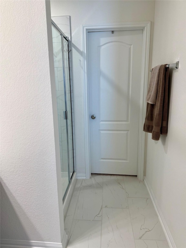2900 Glint Peak Ct, Katy, TX 77493 - hallway with light marble finish floors and baseboards