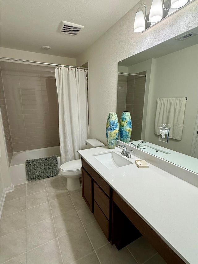2900 Glint Peak Ct, Katy, TX 77493 - bathroom featuring vanity, shower / bath combo with shower curtain, tile patterned flooring, and toilet