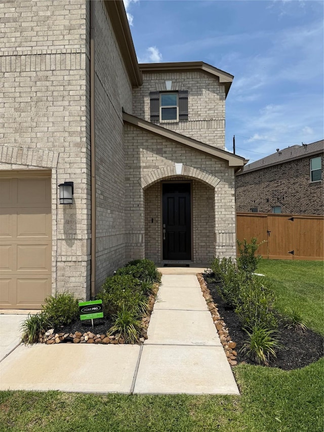 2900 Glint Peak Ct, Katy, TX 77493 - view of exterior entry featuring a garage and brick siding