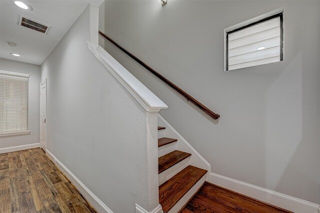 804 Paige St, Houston, TX 77003 - stairs featuring wood finished floors, recessed lighting, and baseboards