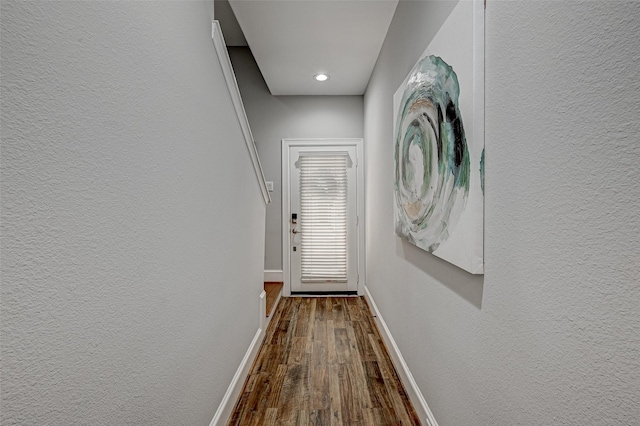 804 Paige St, Houston, TX 77003 - hallway with dark wood-style flooring, baseboards, a textured wall, and recessed lighting