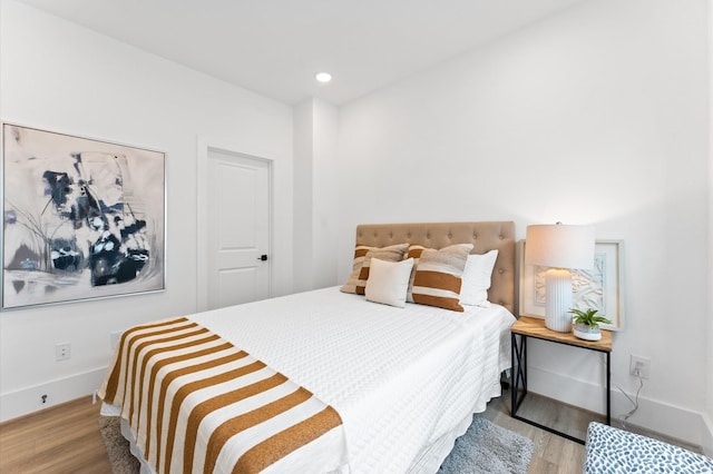 1428 Miller St, Houston, TX 77003 - bedroom featuring wood finished floors, baseboards, and recessed lighting