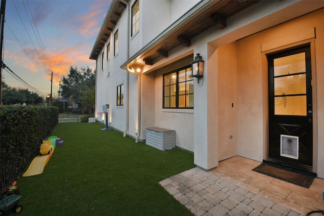 2804 Robinhood St, West University Place, TX 77005 - yard at dusk featuring a patio