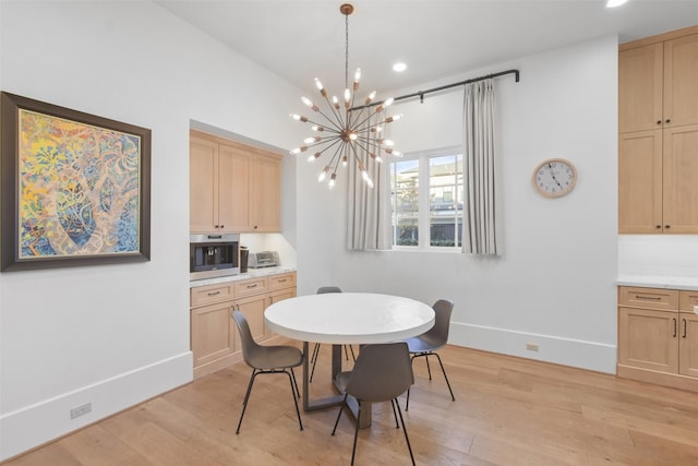 2804 Robinhood St, West University Place, TX 77005 - dining space featuring light wood-style floors, a chandelier, baseboards, and recessed lighting