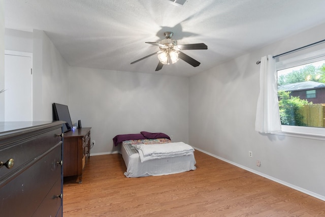 4315 Stallion Brook Ln, Spring, TX 77388 - bedroom with light wood-style floors, baseboards, and a ceiling fan
