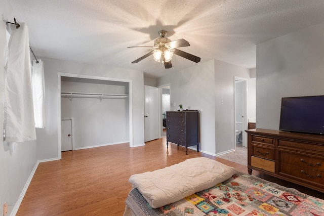 4315 Stallion Brook Ln, Spring, TX 77388 - bedroom with wood finished floors, a closet, baseboards, and ceiling fan