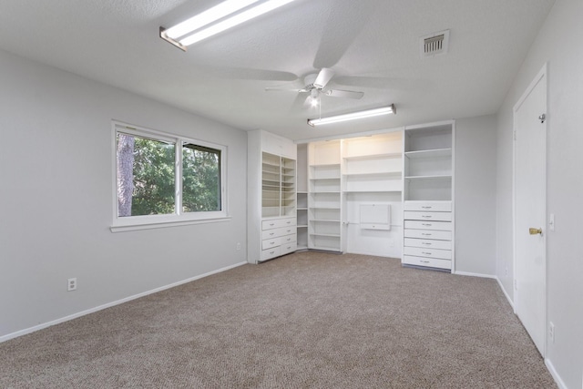 4315 Stallion Brook Ln, Spring, TX 77388 - unfurnished bedroom featuring carpet, a ceiling fan, and a textured ceiling