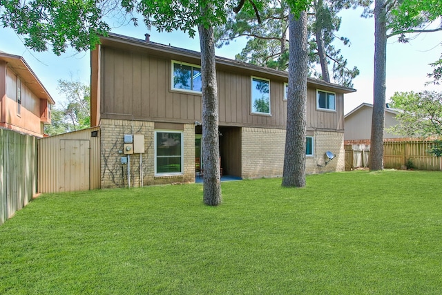 4315 Stallion Brook Ln, Spring, TX 77388 - back of property with a fenced backyard, brick siding, and a storage unit