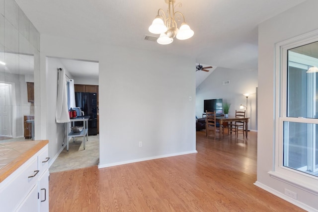 4315 Stallion Brook Ln, Spring, TX 77388 - living room with a desk, light wood-style flooring, a chandelier, ceiling fan, and lofted ceiling