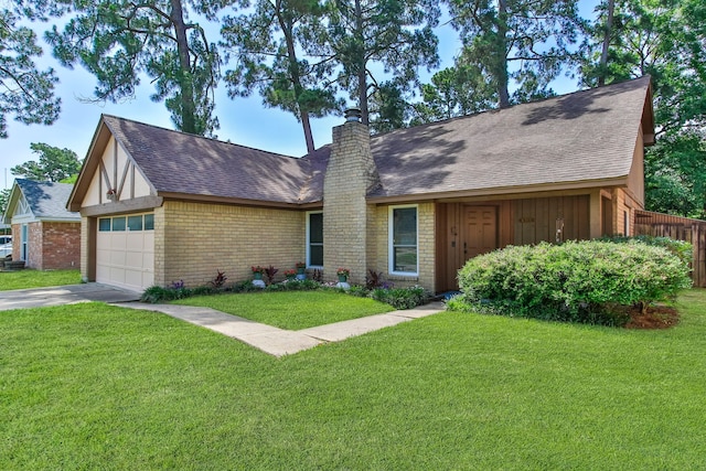 4315 Stallion Brook Ln, Spring, TX 77388 - view of front of house with a chimney, an attached garage, roof with shingles, and brick siding