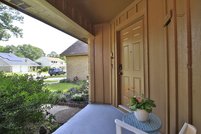 4315 Stallion Brook Ln, Spring, TX 77388 - doorway to property with brick siding, board and batten siding, and a shingled roof