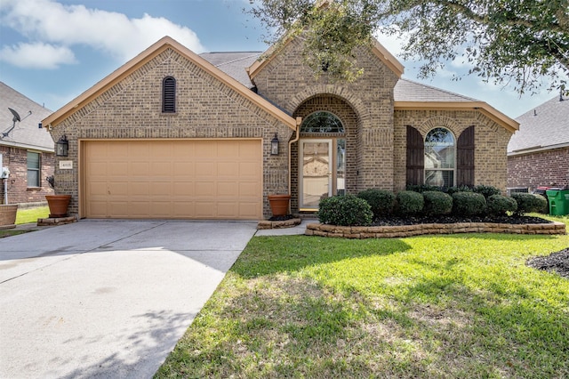 4818 Connor Dr, Baytown, TX 77521 - french country style house with brick siding, an attached garage, driveway, a front lawn, and a shingled roof