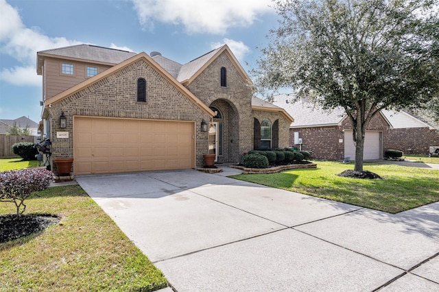4818 Connor Dr, Baytown, TX 77521 - french country inspired facade featuring brick siding, a garage, concrete driveway, and a front yard