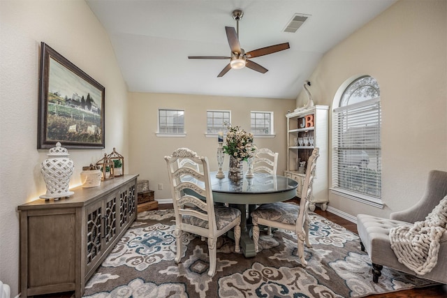 4818 Connor Dr, Baytown, TX 77521 - dining area with vaulted ceiling, ceiling fan, baseboards, and wood finished floors
