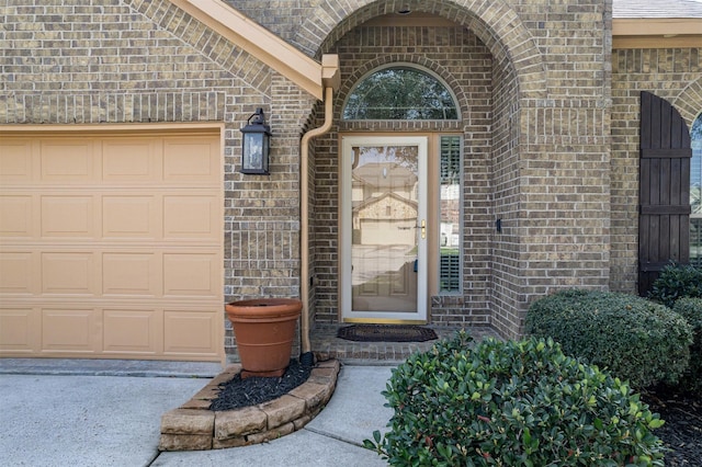 4818 Connor Dr, Baytown, TX 77521 - property entrance featuring brick siding and an attached garage