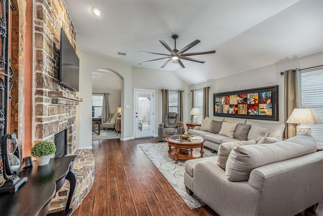4818 Connor Dr, Baytown, TX 77521 - living room with arched walkways, a ceiling fan, plenty of natural light, a fireplace, and vaulted ceiling