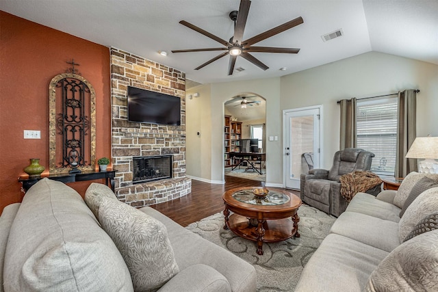 4818 Connor Dr, Baytown, TX 77521 - living room featuring a ceiling fan, wood finished floors, vaulted ceiling, and a fireplace