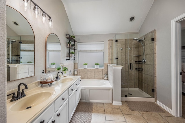 4818 Connor Dr, Baytown, TX 77521 - full bath with vaulted ceiling, a shower stall, a bath, double vanity, and tile patterned flooring