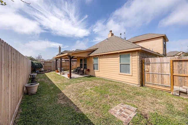 4818 Connor Dr, Baytown, TX 77521 - back of house featuring a patio area, a chimney, and roof with shingles