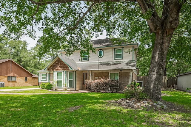 5118 Forest Trl, Baytown, TX 77521 - view of front of property featuring cooling unit, brick siding, and a shingled roof