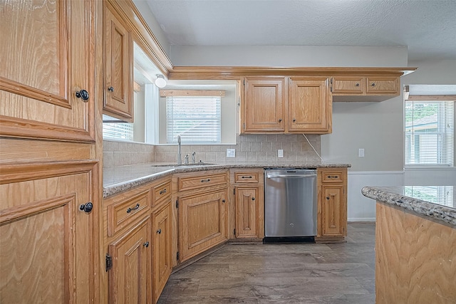 5118 Forest Trl, Baytown, TX 77521 - kitchen featuring dishwasher, a sink, healthy amount of natural light, and tasteful backsplash