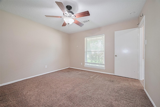 5118 Forest Trl, Baytown, TX 77521 - spare room featuring carpet floors, ceiling fan, a textured ceiling, and baseboards