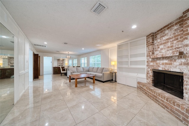7838 Vickijohn Dr, Houston, TX 77071 - living room with a textured ceiling, a brick fireplace, recessed lighting, and built in features