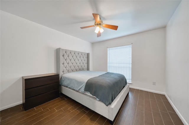 7838 Vickijohn Dr, Houston, TX 77071 - bedroom with baseboards, a ceiling fan, and dark wood-style flooring