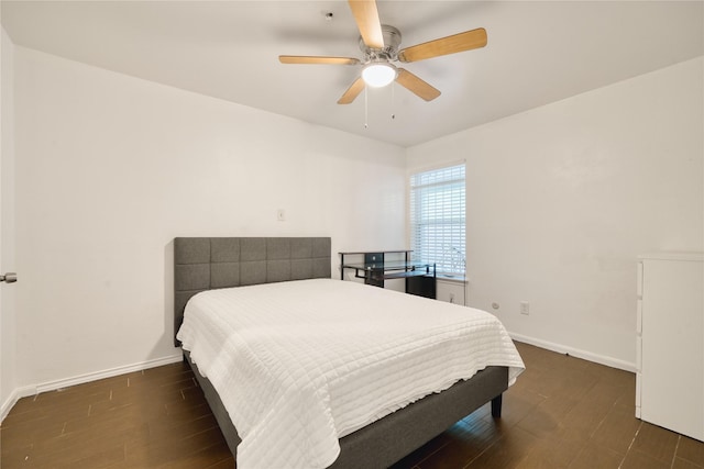 7838 Vickijohn Dr, Houston, TX 77071 - bedroom featuring baseboards, dark wood-style flooring, and ceiling fan