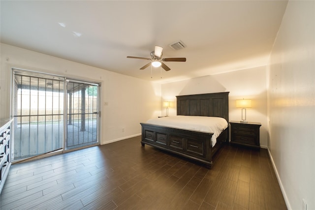 7838 Vickijohn Dr, Houston, TX 77071 - bedroom with baseboards, access to exterior, dark wood-style floors, and a ceiling fan